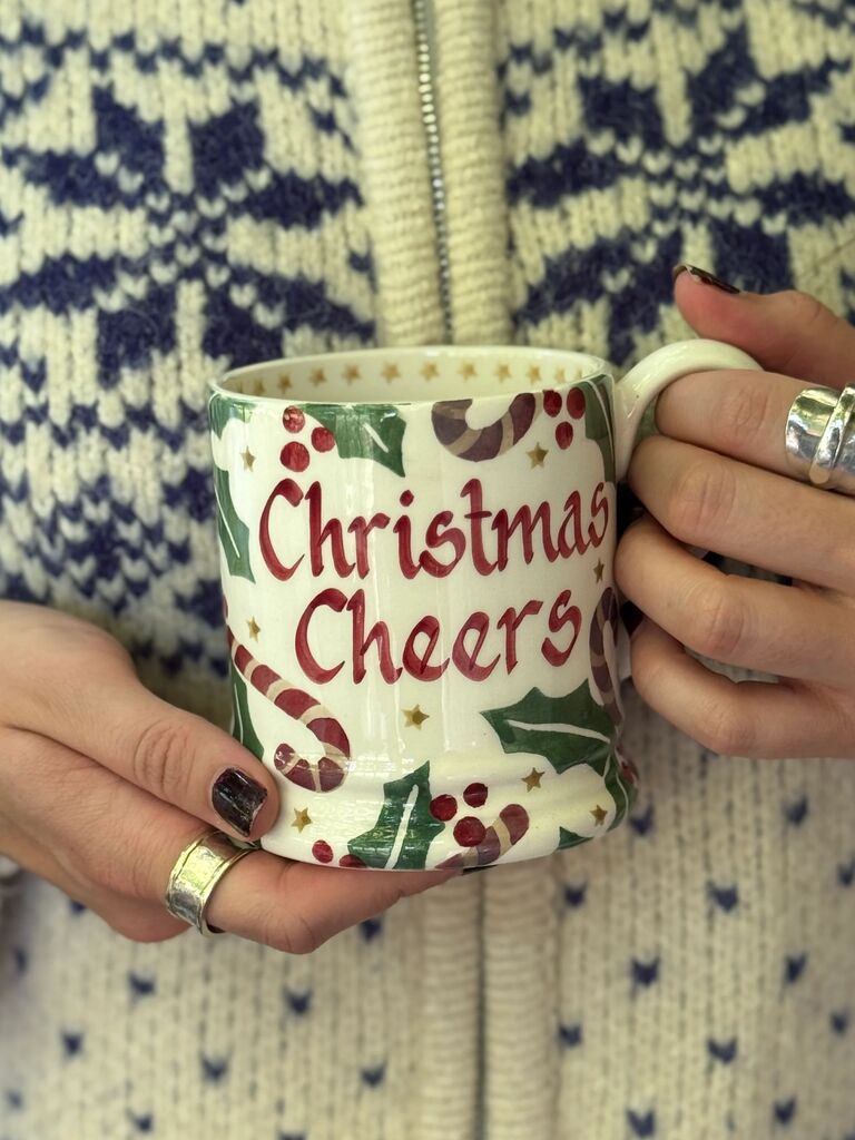 Hand-painting pink heart mug with 'Love you' text, showcasing personalised ceramic art and gift craftsmanship.