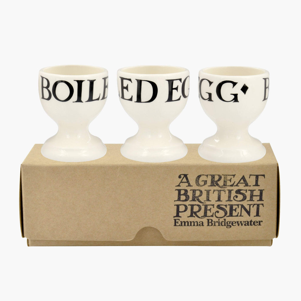 Emma Bridgewater 3 Egg Cups in the classic black and white colour and is made from 100% English earthenware. The boxed product features a minimalistic design with letterings 'Boiled Egg' printed onto each cup. A great British present for breakfast lovers.